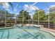 Sparkling screened in pool and spa with paver deck and manicured hedges at 11401 Willow Stowe Ln, Windermere, FL 34786