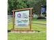 Sign for Dixie Cream Cafe, Tim's Wine and Beer, and Lakeside Real Estate with contact information at 11401 Willow Stowe Ln, Windermere, FL 34786