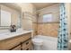 Updated bathroom with a modern vanity, tiled shower, and stylish fixtures at 1153 Perpignan Ct, Kissimmee, FL 34759
