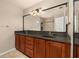 Bathroom features a dual sink vanity with a large mirror, and plenty of storage at 1153 Perpignan Ct, Kissimmee, FL 34759