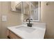 Bathroom featuring new vanity, undermount sink, modern faucet, and lighted mirror at 1153 Perpignan Ct, Kissimmee, FL 34759