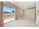 Open dining room features tile floors, a modern light fixture, and sliding glass doors to the backyard at 1153 Perpignan Ct, Kissimmee, FL 34759