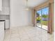 Bright dining area features tile floors and sliding glass doors leading to the outdoors at 1153 Perpignan Ct, Kissimmee, FL 34759