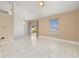 Open dining room featuring tile floors, a modern light fixture, and sliding glass doors to the backyard at 1153 Perpignan Ct, Kissimmee, FL 34759