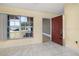 Bright entryway featuring a red front door, tile flooring, and a window with a view of the outdoors at 1153 Perpignan Ct, Kissimmee, FL 34759