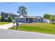Charming single-story home with a well-manicured lawn and attached garage at 1153 Perpignan Ct, Kissimmee, FL 34759