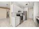 Bright kitchen with ample counter space, white cabinetry, and an open layout to the living area at 1153 Perpignan Ct, Kissimmee, FL 34759