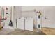 Garage laundry area features a washer, dryer, and water heater at 1153 Perpignan Ct, Kissimmee, FL 34759