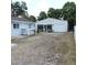 View of backyard and detached garage at 1160 Rolling Acres Dr, Deland, FL 32720