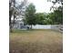 A spacious backyard area with a privacy fence and mature trees, enhancing the sense of seclusion and tranquility at 1160 Rolling Acres Dr, Deland, FL 32720