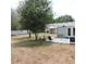 The patio complements a sprawling backyard, which features a shade tree at 1160 Rolling Acres Dr, Deland, FL 32720