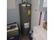 Basement with a hot water heater and gray block walls at 1160 Rolling Acres Dr, Deland, FL 32720