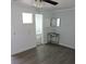 Bathroom area with metal wash basin, vinyl floors, small mirror and view into the bathroom at 1160 Rolling Acres Dr, Deland, FL 32720