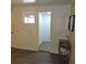 Bathroom area with metal wash basin, small mirror and view into the bathroom at 1160 Rolling Acres Dr, Deland, FL 32720