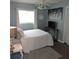 This bedroom has neutral wall colors and wood-look flooring at 1160 Rolling Acres Dr, Deland, FL 32720