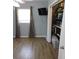 Bedroom featuring tiled floor, neutral paint, and closet with curtain at 1160 Rolling Acres Dr, Deland, FL 32720