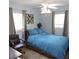 Relaxing bedroom featuring a comfortable bed, stylish ceiling fan and ample natural light at 1160 Rolling Acres Dr, Deland, FL 32720