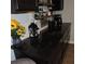 Convenient coffee bar area with dark cabinets and floating shelves for storage and accessories at 1160 Rolling Acres Dr, Deland, FL 32720