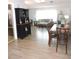 Bright and airy dining room with hardwood floors, connecting to a living area with ample natural light at 1160 Rolling Acres Dr, Deland, FL 32720