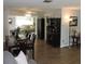 Dining room with wood floors, neutral walls, and dining table with dark wood chairs at 1160 Rolling Acres Dr, Deland, FL 32720