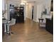Open-concept dining room with hardwood floors, leading to a cozy seating area and stylish decor at 1160 Rolling Acres Dr, Deland, FL 32720