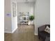 Welcoming entryway with wood-look tile, light gray paint, and decorative shelving at 1160 Rolling Acres Dr, Deland, FL 32720