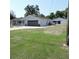 Single-story home with long driveway and additional garage at 1160 Rolling Acres Dr, Deland, FL 32720