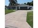 Single-story home with a long driveway at 1160 Rolling Acres Dr, Deland, FL 32720