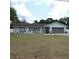 Charming one-story home featuring a well-manicured lawn, tidy landscaping, and a two-car garage at 1160 Rolling Acres Dr, Deland, FL 32720