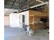 Garage interior with ample storage space and built-in shelving with visible overhead framework at 1160 Rolling Acres Dr, Deland, FL 32720