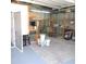 Garage interior with visible storage shelving and equipment and blue painted concrete floor at 1160 Rolling Acres Dr, Deland, FL 32720
