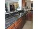 This kitchen features a stainless steel sink and granite countertops at 1160 Rolling Acres Dr, Deland, FL 32720