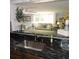 Bright, open concept living area viewed from the kitchen featuring a granite countertop bar at 1160 Rolling Acres Dr, Deland, FL 32720