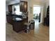 Kitchen featuring granite countertops, wood cabinets, and stainless steel appliances at 1160 Rolling Acres Dr, Deland, FL 32720