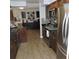 Kitchen featuring modern appliances and dark wood cabinets at 1160 Rolling Acres Dr, Deland, FL 32720