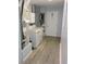 A laundry room featuring a washer, dryer, utility sink, and storage cabinets at 1160 Rolling Acres Dr, Deland, FL 32720