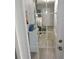 A bright laundry area features a washer, dryer and storage, seen through a glass paneled door at 1160 Rolling Acres Dr, Deland, FL 32720