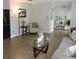Inviting living room showcasing wood-look tile, stylish decor, and comfortable seating at 1160 Rolling Acres Dr, Deland, FL 32720