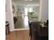 Open living space with hardwood floors that seamlessly flows into the adjacent dining area at 1160 Rolling Acres Dr, Deland, FL 32720
