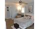 Comfortable main bedroom with a ceiling fan, sitting area, and neutral colors to create a relaxing atmosphere at 1160 Rolling Acres Dr, Deland, FL 32720