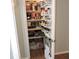 Organized pantry with shelving, providing ample storage for food and household items at 1160 Rolling Acres Dr, Deland, FL 32720