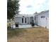 A lovely covered patio has room for outdoor seating at 1160 Rolling Acres Dr, Deland, FL 32720