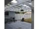 The covered patio has an overhead fan and outdoor seating at 1160 Rolling Acres Dr, Deland, FL 32720