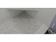 Shower with white penny tile flooring and a built-in bench seat at 1160 Rolling Acres Dr, Deland, FL 32720