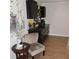 Comfortable sitting room displaying a plush chair and dark furniture at 1160 Rolling Acres Dr, Deland, FL 32720