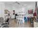 bedroom with a white bunk bed, desk, toys, a ceiling fan and light wood floors at 11734 Lake Willis Dr, Orlando, FL 32821