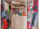 Organized walk-in closet with built-in shelving, drawers, and ample storage for clothing at 11734 Lake Willis Dr, Orlando, FL 32821