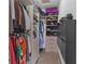 Organized walk-in closet with ample storage and custom shelving at 11734 Lake Willis Dr, Orlando, FL 32821