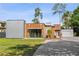 Modern home with wood and metal exterior, showcasing a clean and contemporary design at 11734 Lake Willis Dr, Orlando, FL 32821