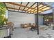 Outdoor patio area with a grill, seating, and fire pit, perfect for entertaining at 11734 Lake Willis Dr, Orlando, FL 32821